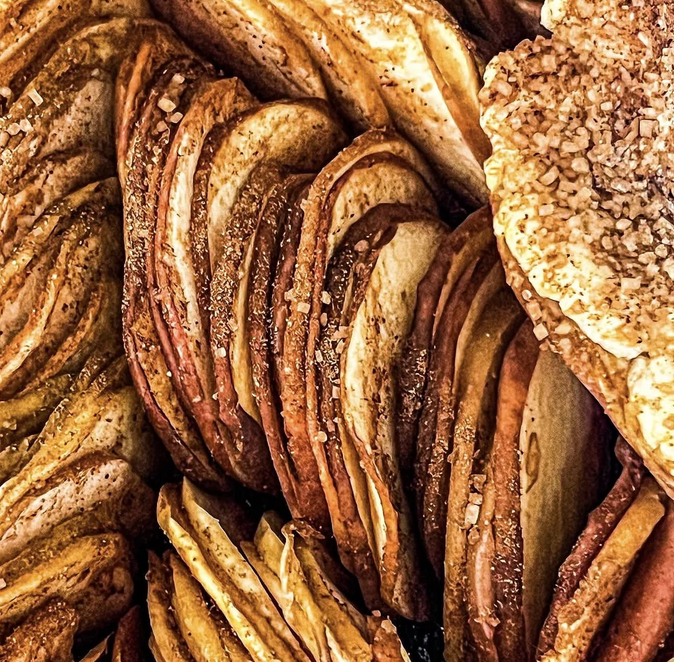 Close-up of sliced apple galette showing layered apples with cinnamon sugar crust