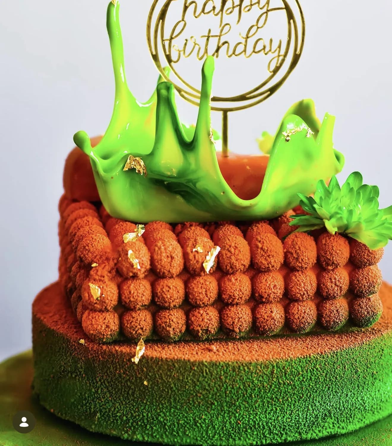 Matcha cake with green splash crown cocoa tiramisu layer and Happy Birthday hoop topper